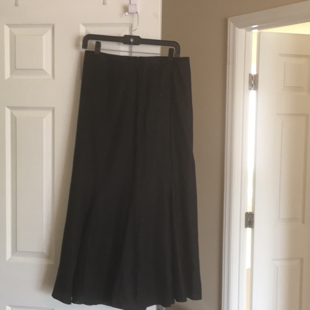 Long black pleated skirt. 100%linen satin lining.